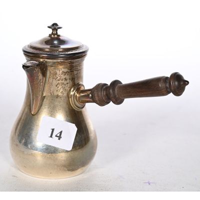 a silver coffee pot with a wooden handle on a white background