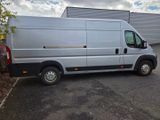 a silver van that is parked in a parking lot
