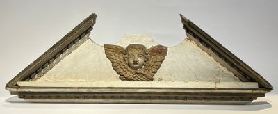Dessus de porte de boiserie figurant une tête d'angelot et f…