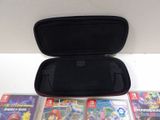 a nintendo wii carrying case with a lot of games