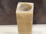 a marble vase that is sitting on a table