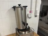 a coffee pot sitting on a counter in a kitchen