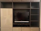 a picture of a living room with a flat screen tv