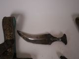 a pair of shoes and a knife on a table