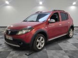 a picture of a red dacia parked in a room