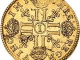 a gold coin with a cross and symbols on it
