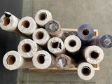many rolls of toilet paper sitting on top of a wooden box