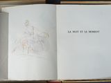 an open book with a drawing of a man riding a horse