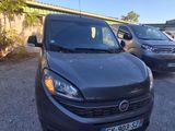 a black van parked in a parking lot next to other cars