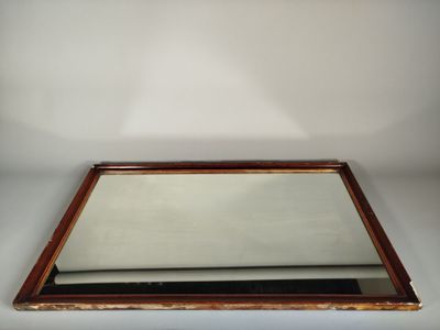 an image of a mirror sitting on top of a wooden table