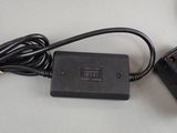 an image of a charger that is plugged into a laptop