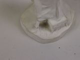 a statue of a woman standing on top of a table