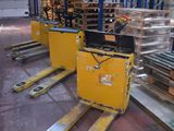 many pallets of pallets in a warehouse with pallets on them