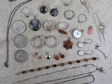 a lot of jewelry that is laying out on the floor