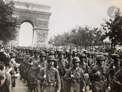 a lot of men in uniform marching down the street