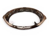 a close up of a metal bracelet on a white background