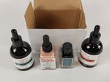 three bottles of liquid and a bottle of liquid in a box