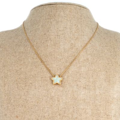 a gold necklace with a star pendant on a mannequin mannequin mannequin mannequin mannequin mannequin mannequin manne