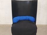 an image of a black chair with a blue pillow on top of it