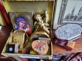 a wooden table topped with a box filled with assorted items