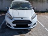a white car that is parked in a parking lot