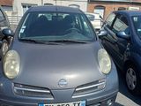 a small car that is parked in a parking lot