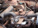 a close up view of an old engine in a rusted out vehicle
