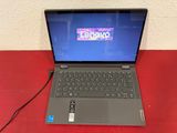 an open laptop computer sitting on top of a red table