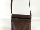 a brown leather purse with a zipper on the top of it