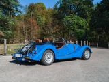 an image of a blue sports car parked in a parking lot