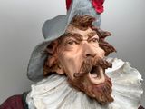 a statue of a man with a beard and a hat