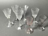 a lot of wine glasses sitting on a table