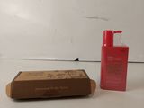 a box of soap and a bottle of lotion sitting on a table