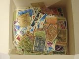 a box full of postage stamps sitting on a table