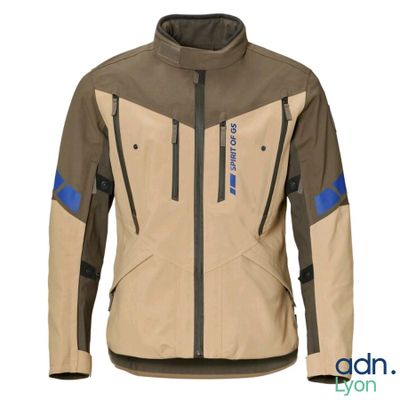 the jacket is tan and blue with a black zipper on the chest