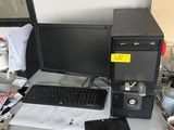 a desktop computer sitting on a desk with a keyboard and mouse