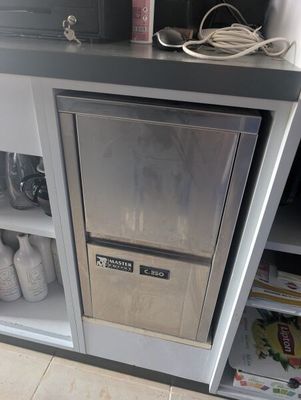 a silver refrigerator with a silver door in a kitchen