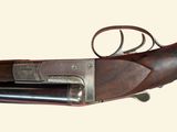 an old gun with a wooden body and a metal handle