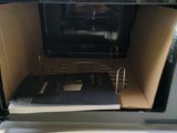 a microwave with a microwave oven inside of it