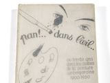 an old book with a drawing of a woman ' s face on it