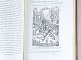an open book with a black and white drawing on it
