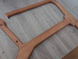 a close up of a wooden frame on a table
