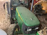 a tractor that is parked in a garage