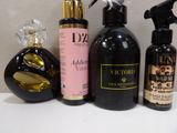 several different types of perfumes are lined up on a counter