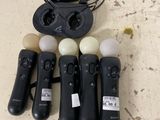 a lot of remote controls that are sitting on a table