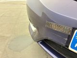 a close up of a car ' s license plate on the front of a car