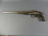 an old gun that is sitting on top of a table