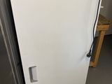 a white refrigerator that is sitting in a kitchen
