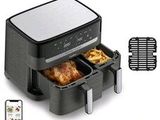 a close up of an air fryer with two trays of food