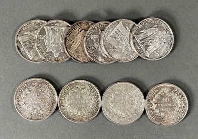 a close up of a bunch of coins sitting on top of a table